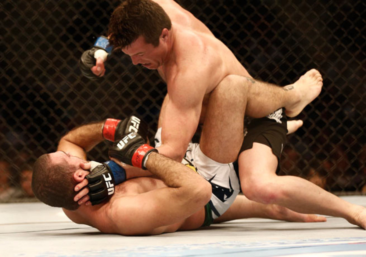 Chael Sonnen (top) fights Shogun Rua (bottom) during a UFC light heavyweight match at the TD Garden