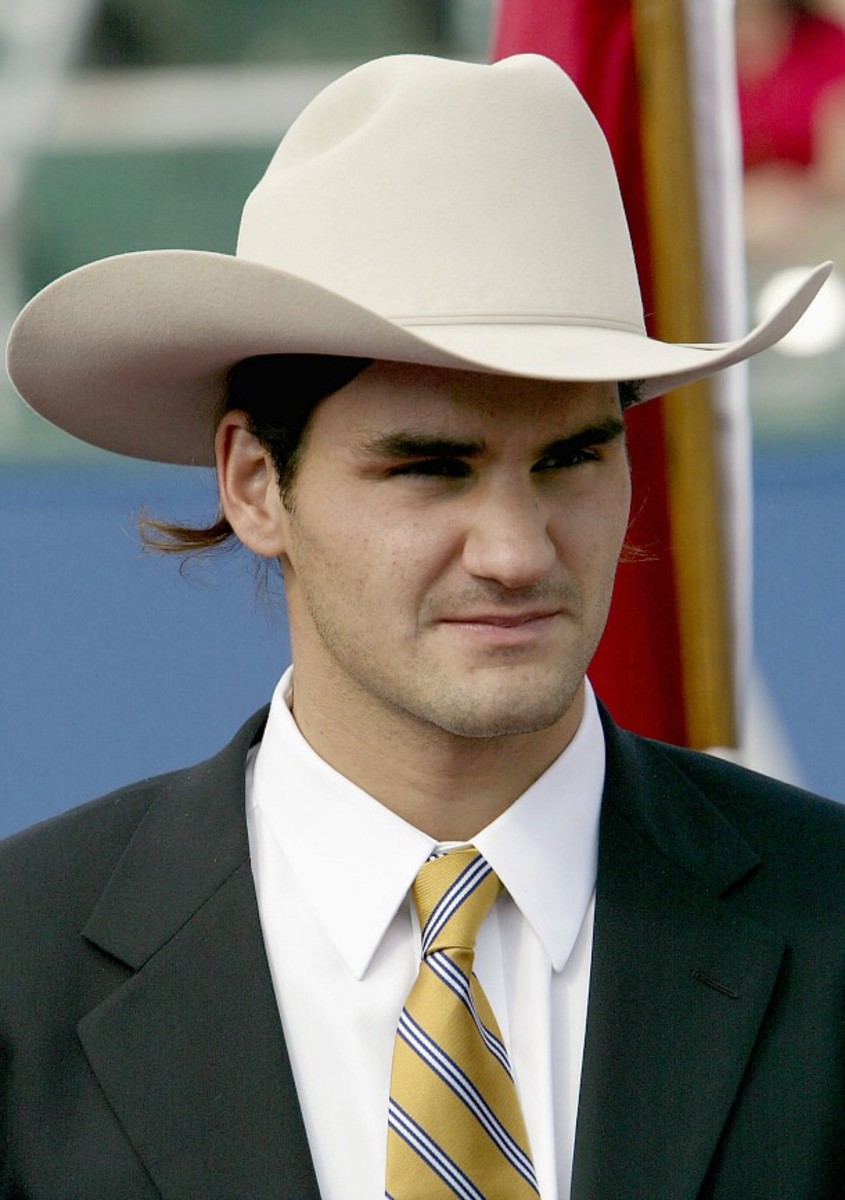 When in Rome: Federer dons a cowboy hat during the opening ceremony of the Tennis Masters Cup in Houston in 2003. (Clive Brunskill/Getty Images)