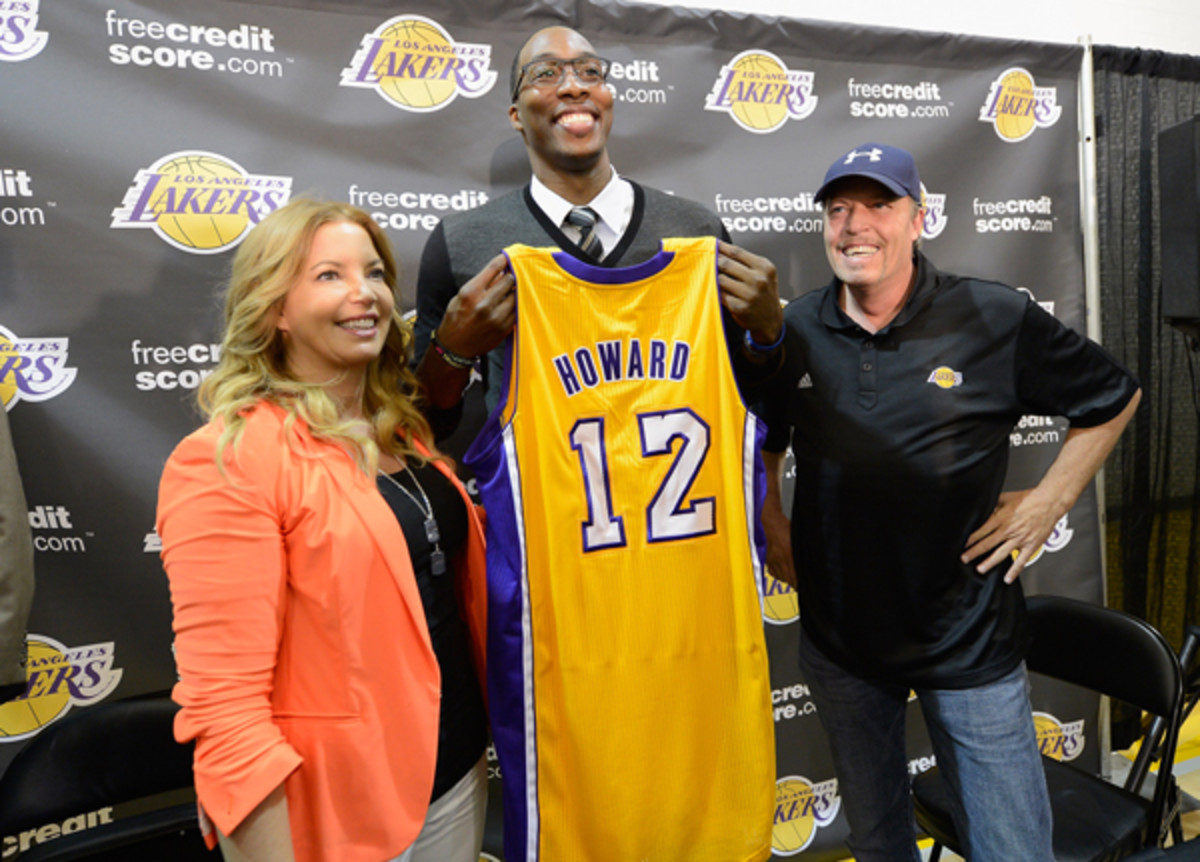 Lakers executive Jim Buss (right) introduced Dwight Howard in August 2012. (Kevork Djansezian/Getty Images Sport)