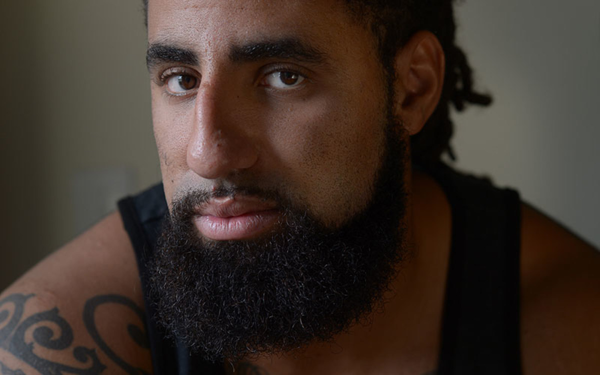 Without a uniform to wear, Austen Lane is struggling to come to grips with his future in football. (Bill Frakes/SI)