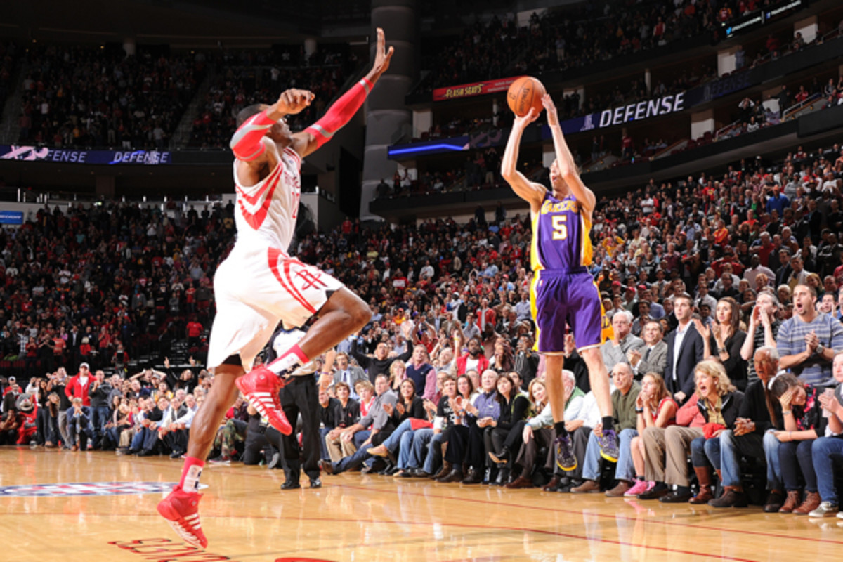 Steve Blake knocks down the game-winner over Dwight Howard. (Bill Baptist/Getty Images)