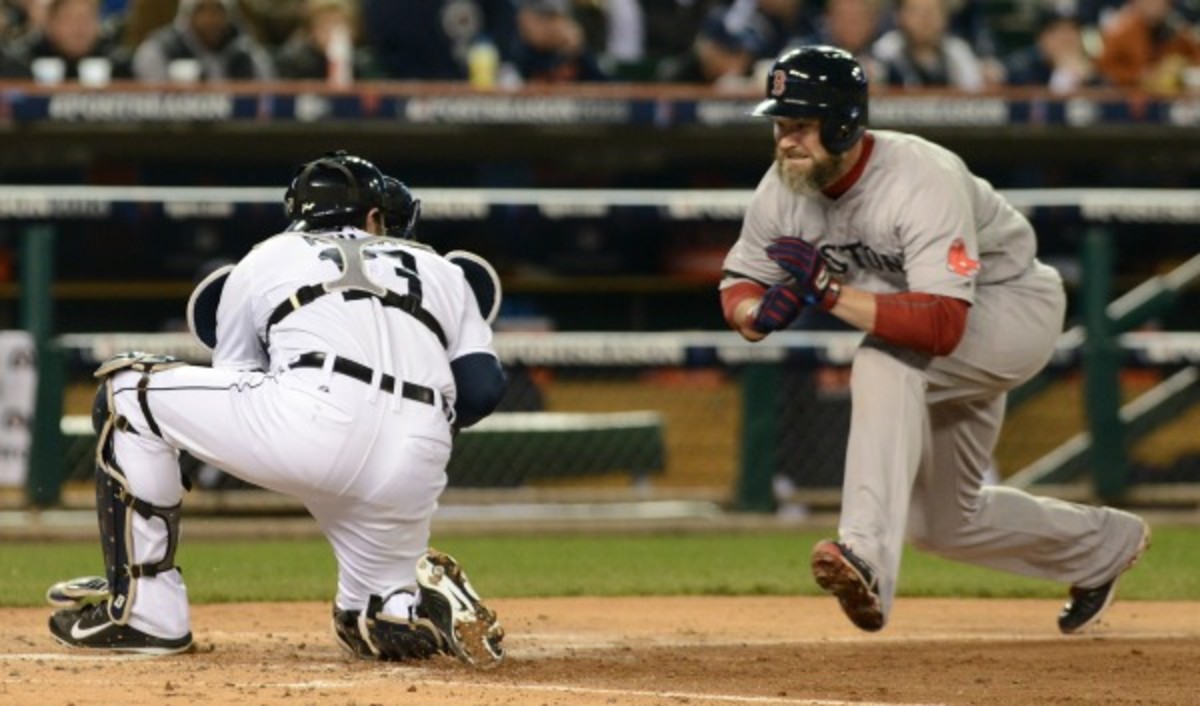 Major League Baseball plans to ban home plate collisions like this one between Alex Avila and David Ross during the 2013 ALCS. (Mark Cunningham/Getty Images)