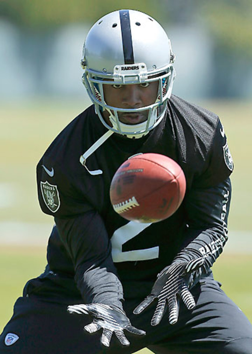 Charles Woodson, back in black, will play a hybrid role in the Raiders’ secondary scheme. (Jeff Chiu/AP)