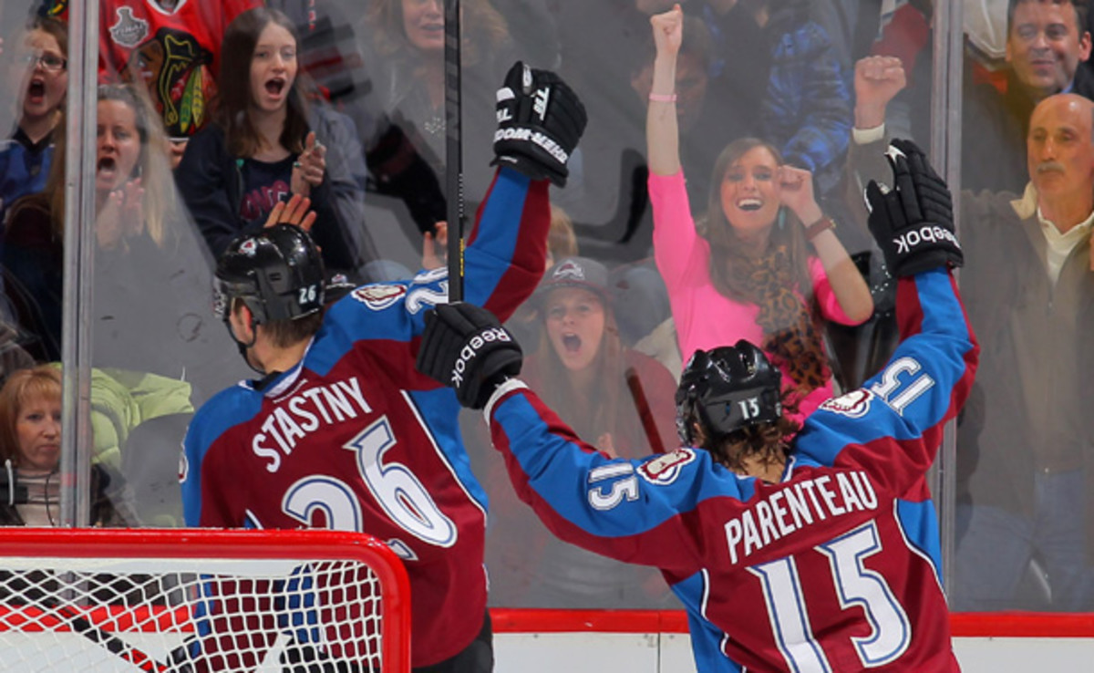 Paul Stasny and P.A. Parenteau celebrate a goal on Friday night during the Avs' 6-2 win over the Blackhawks. [Doug Pensinger/Getty Images]
