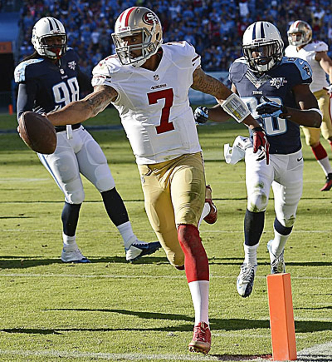 Colin Kaepernick didn't throw for a touchdown, but he ran for one as the 49ers continued their rebound from a slow start to the season. (Mark Zaleski/AP)