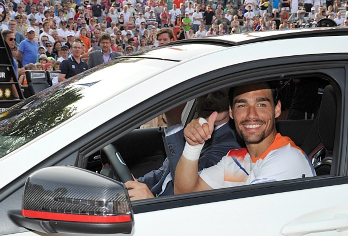 Fabio Fognini drives away in his new Mercedes Benz A45 AMG. (Thomas Kienzle/AFP/Getty Images)