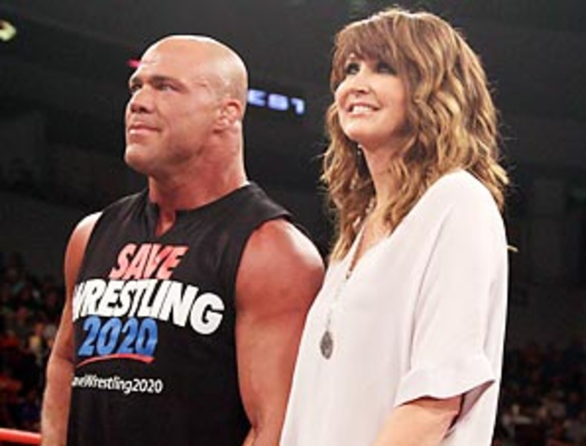 Dixie Carter arm-in-arm with 1996 Olympic wrestling gold medalist and TNA superstar Kurt Angle.
