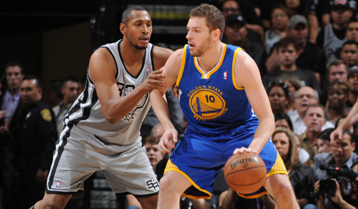 David Lee (right) averaged more than 11 rebounds a game last season with the Warriors. (Garrett W. Ellwood/NBAE via Getty Images)