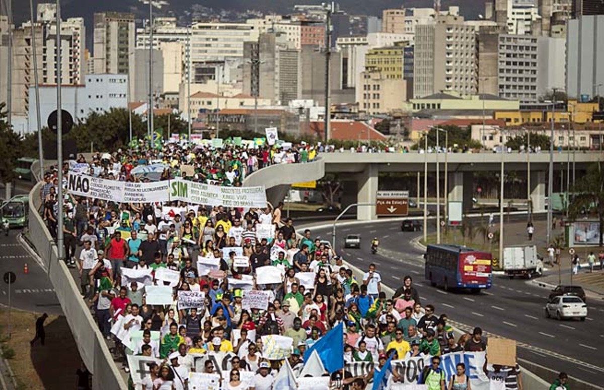 People march toward the Mineirao stadium in Belo Horizonte before a Japan-Mexico match on Saturday.