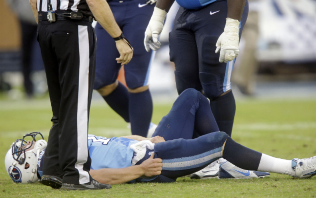 Jake Locker was carted off the field with an apparent hip injury Sunday. (AP Photo/Wade Payne)