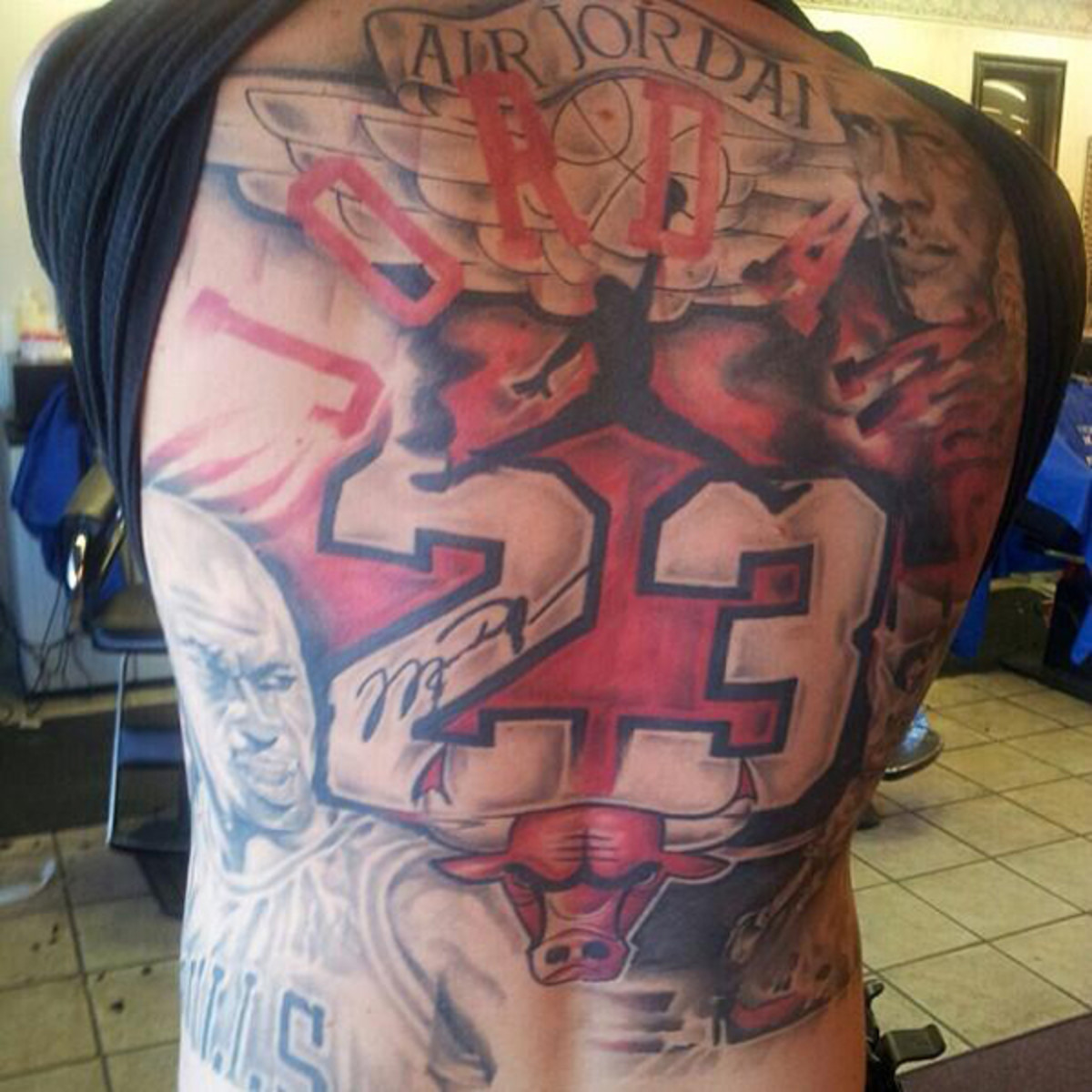 Michael Jordan tribute tattoo mural covers fan's entire back.