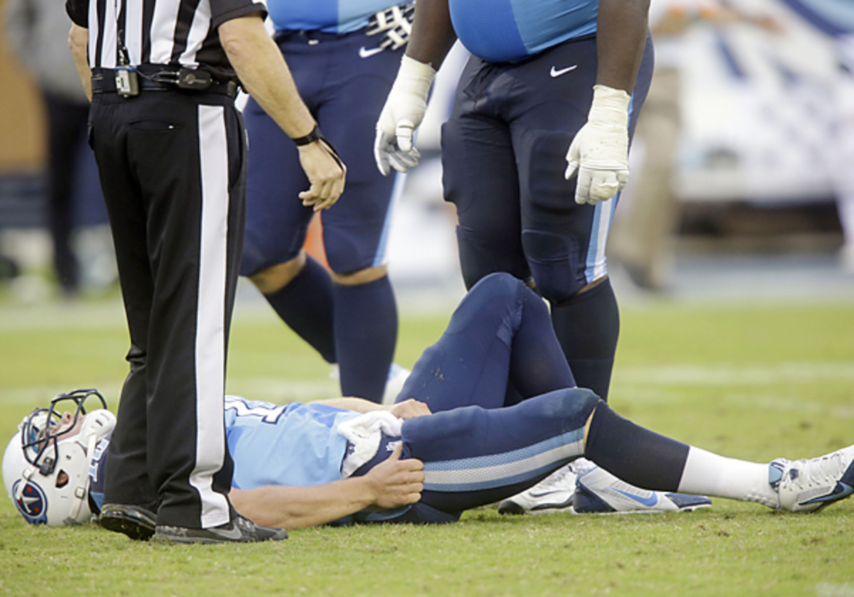 Jake Locker threw for three touchdowns vs. the Jets before a hip injury saw him leave the game on a stretcher. (Wade Payne/AP)