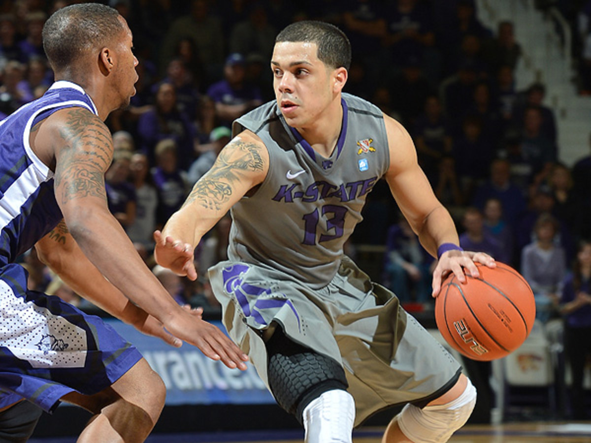Angel Rodriguez's departure is the latest blow to the competitiveness of the Big 12. (Peter G. Aiken/Getty Images)