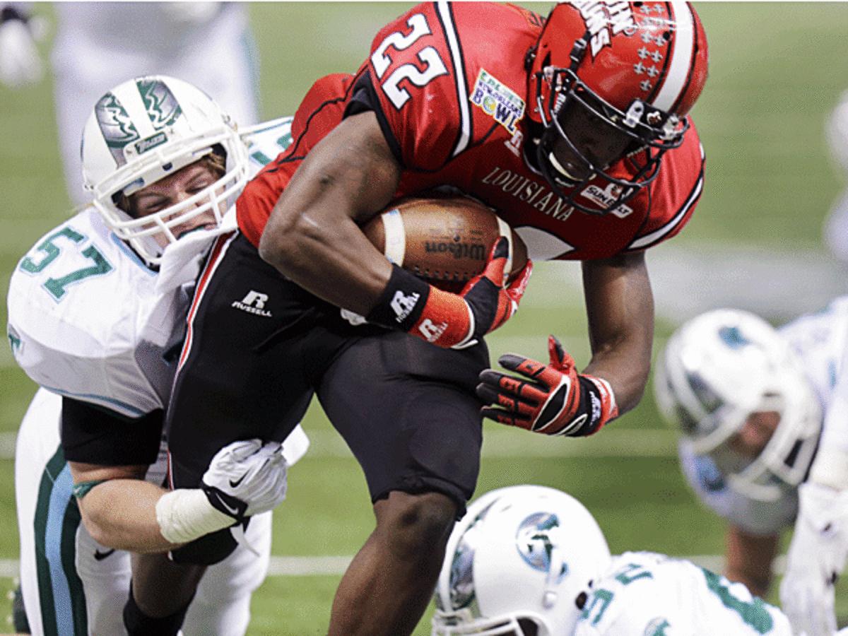 Louisiana-Lafayette RB Elijah McGuire (22) plunged in for a TD during its win over Tulane. (Bill Haber/AP)