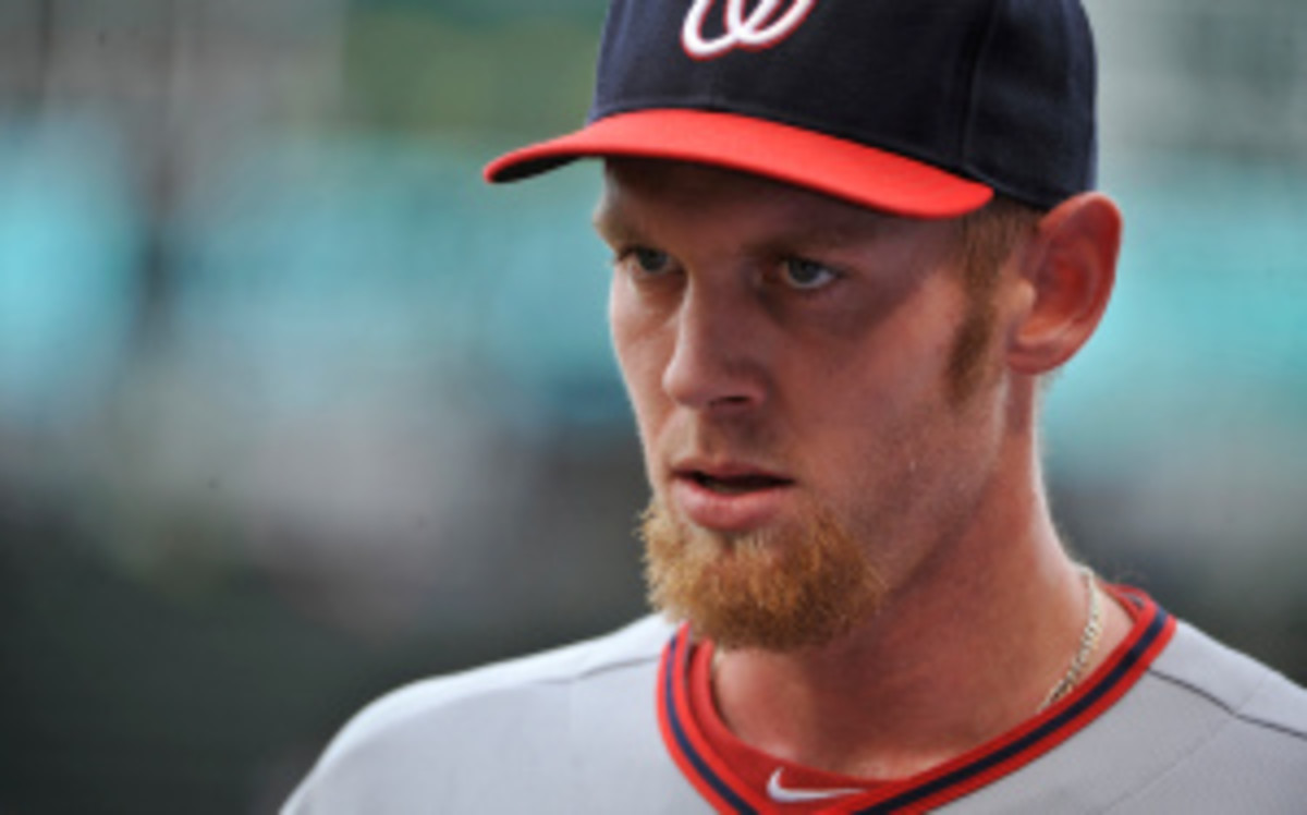 Nationals pitcher Stephen Strasburg was scratched for Thursday's game vs. the Marlins, a reversal to the decision manager Davey Johnson made on Tuesday when he said the right-hander will play Sept. 19. (David Banks/Getty Images)