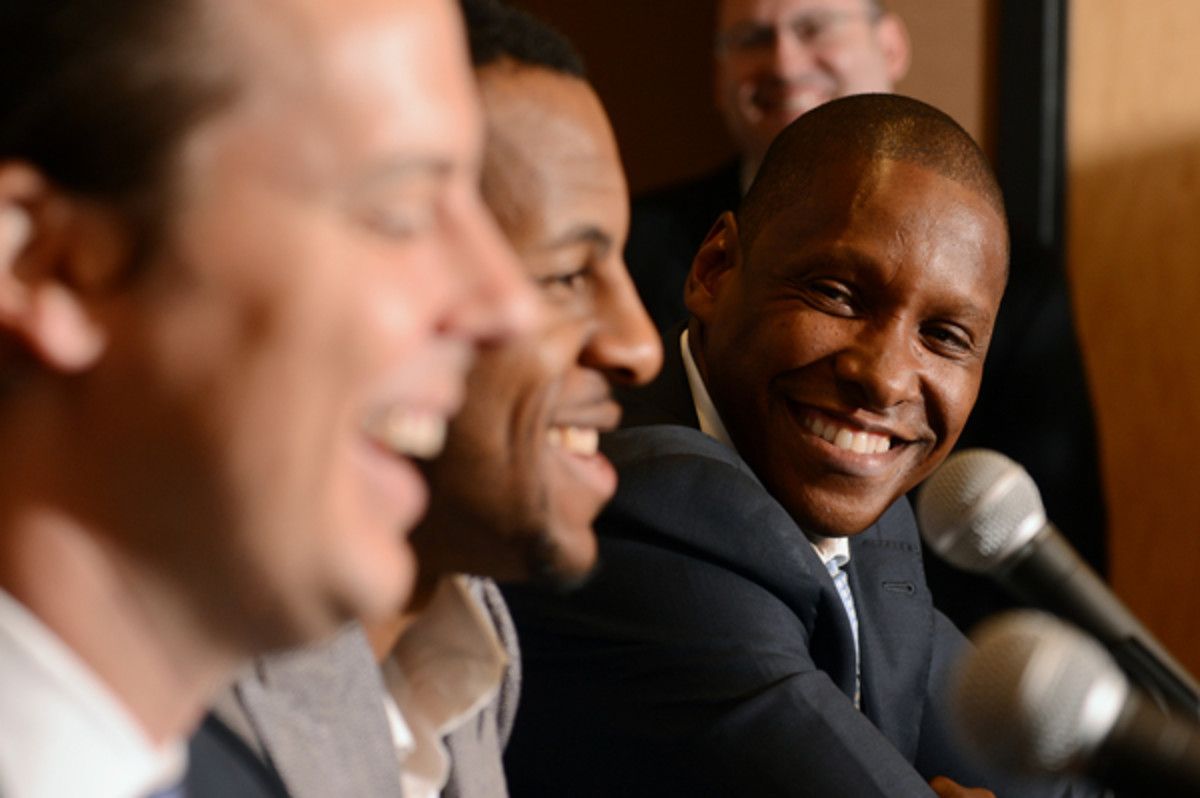 Masai Ujiri, right, has been named 2013 Executive of the Year. (Garrett Ellwood/Getty Images)