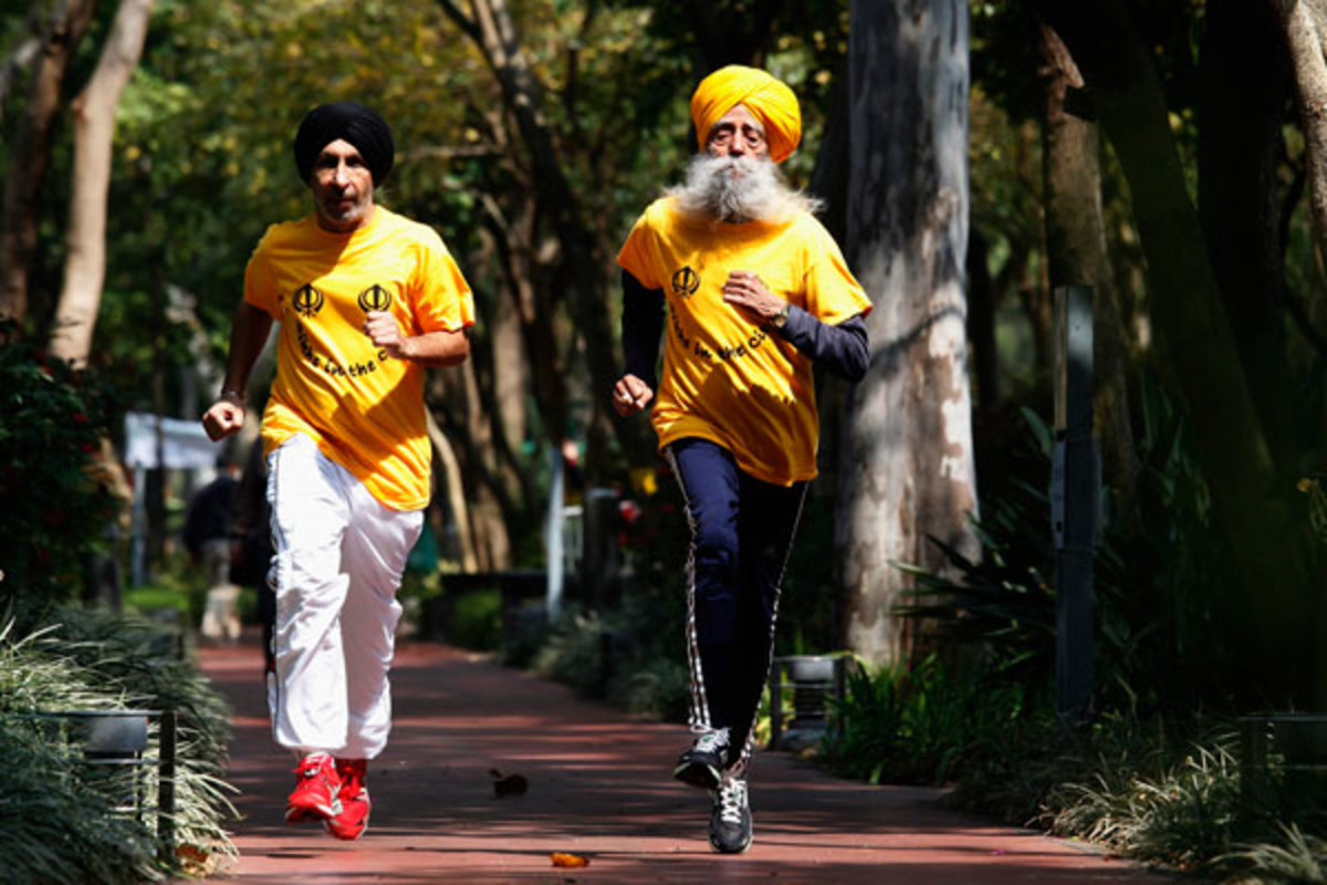 Singh jogs with his trainer, Harmander Singh, before the marathon. (Reuters)
