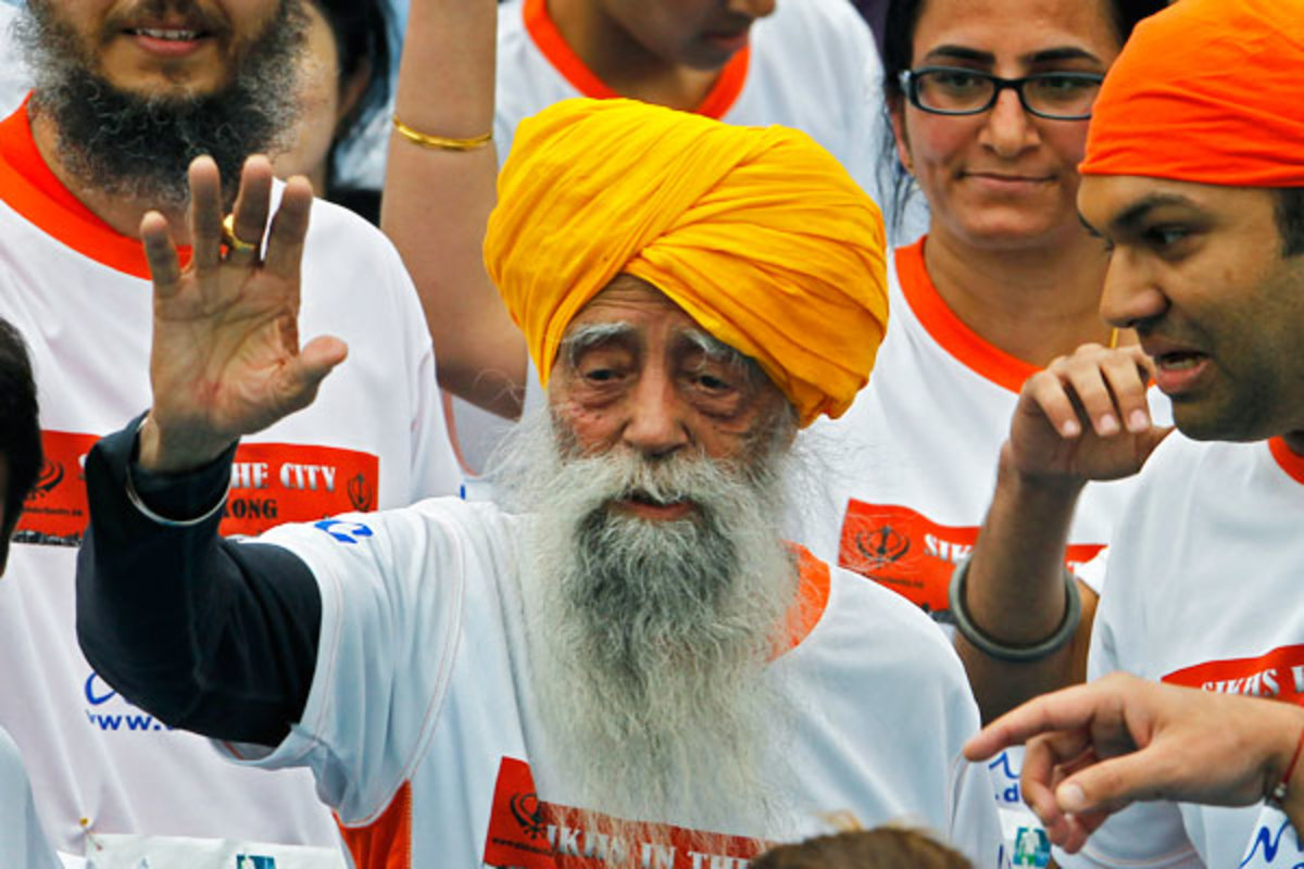Singh waves after completing the race. (AP)