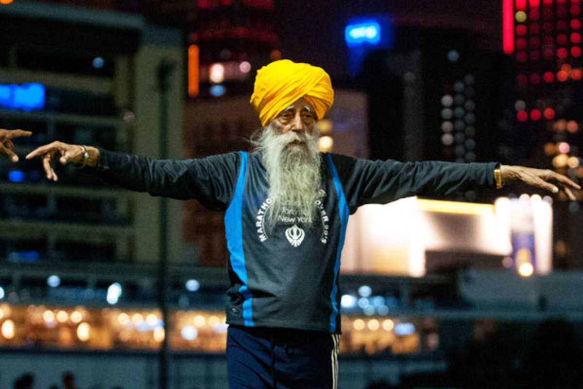 Faujah Singh, 101, warms up ahead of the Hong Kong Marathon. (Getty Images)