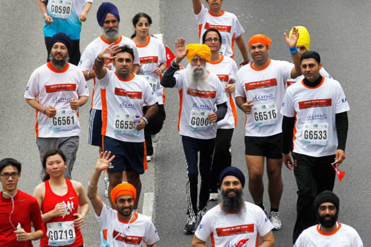 Singh salutes the crowd during the race. (AP)