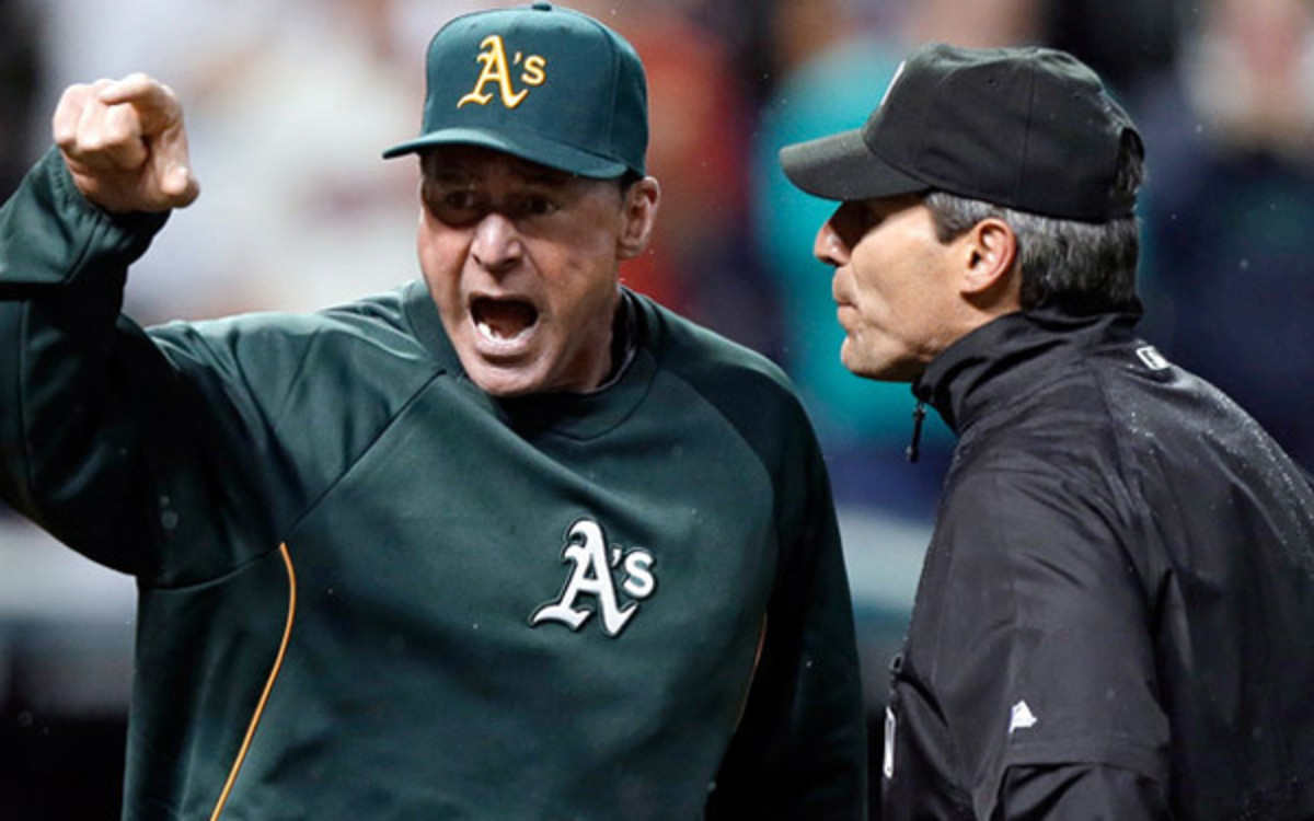 With instant replay coming in 2014, managers will be able to challenge calls. (Mark Duncan/AP)