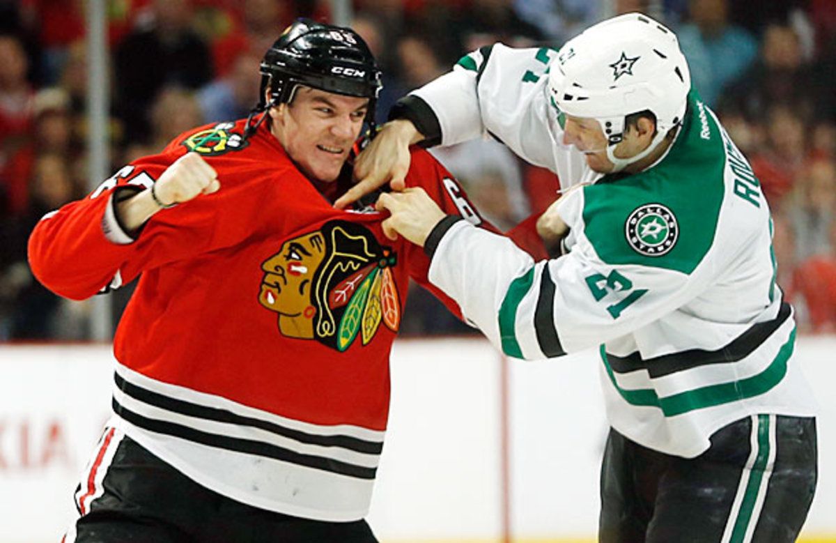 Andrew Shaw of the Chicago Blackhawks fights Antoine Roussel of the Dallas Stars.