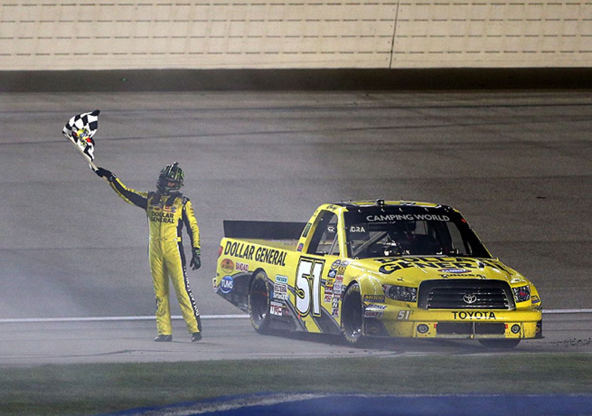 Kyle Busch celebrated with his truck following his win at Chicagoland Speedway.