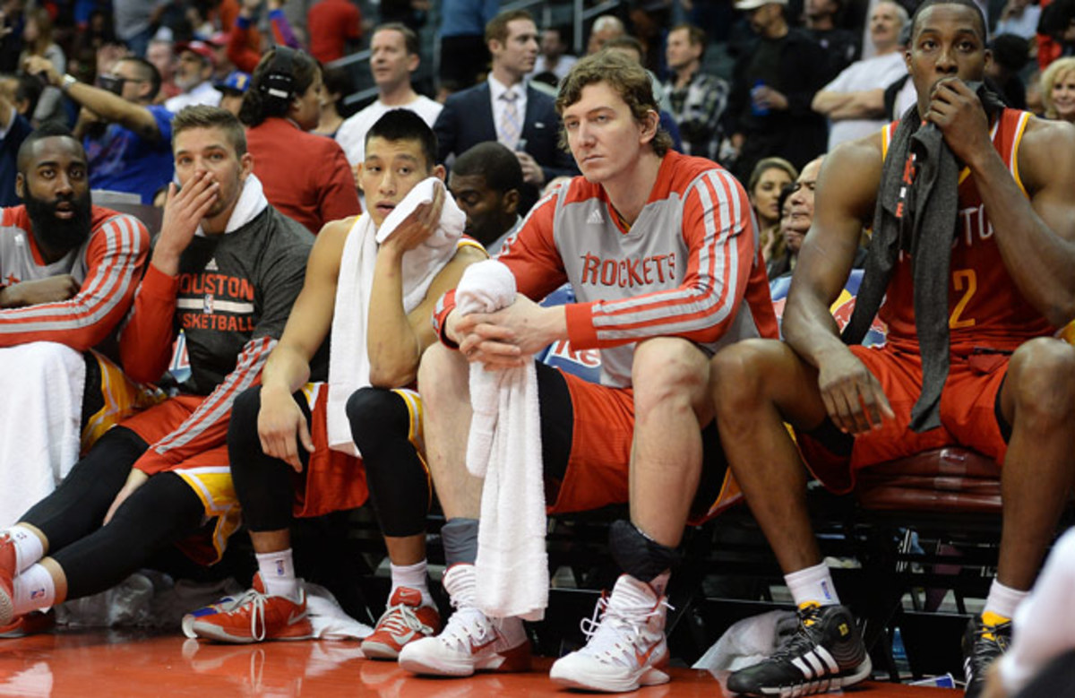 Unhappy with his role, Omer Asik (center) has reportedly requested a trade from the Rockets.