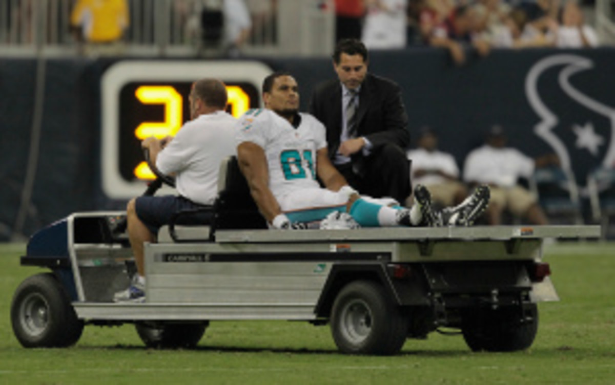 NFL owners could vote in March whether to ban hits to the knees of defenseless players, such as the one this preseason that ended Miami Dolphins tight end Dustin Keller's year. (Bob Levey/Getty Images)