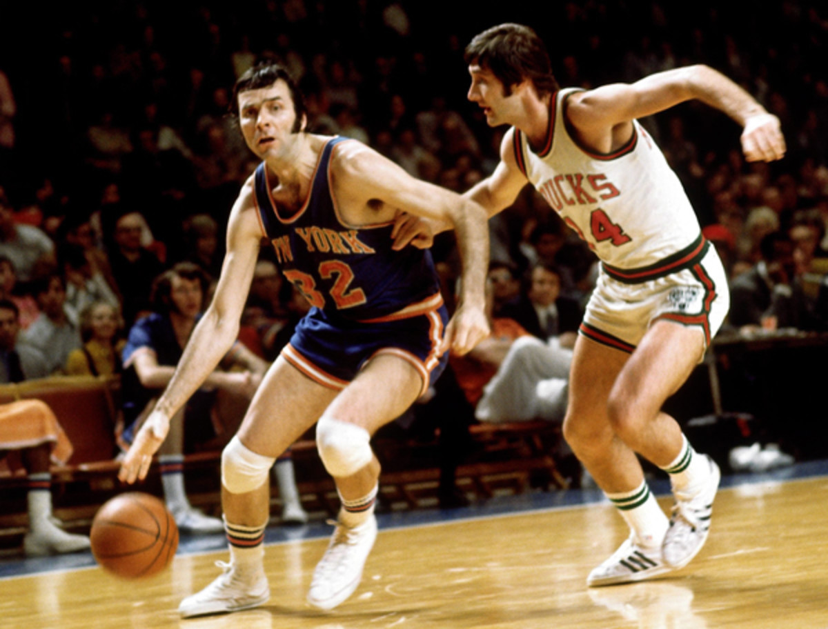 Jerry Lucas (left) drives to the hoop a a member of the Knicks in 1970. (NBA Photo Library/Getty Images)