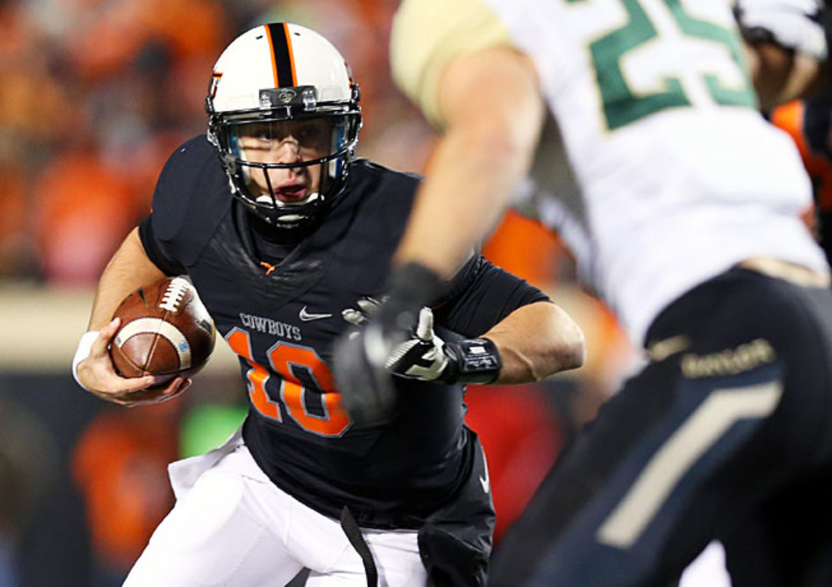 Clint Chelf (10) and Oklahoma State have won seven straight since a loss at West Virginia on Sept. 28.