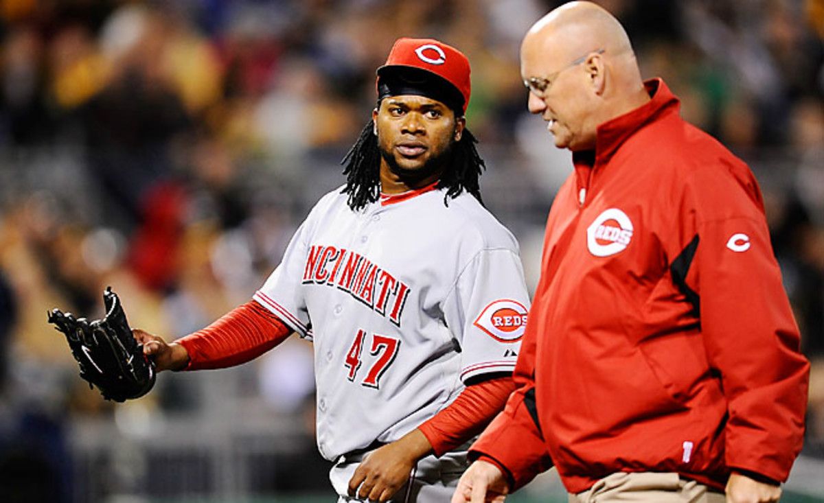 Cincinnati's Johnny Cueto left with pain in his right triceps after 4 1/3 innings on Saturday night.