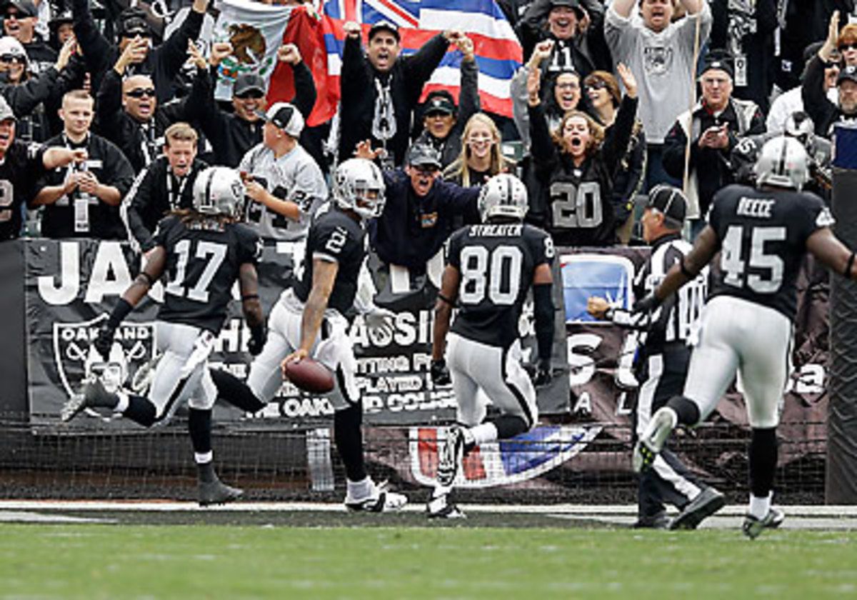 Terrelle Pryor set records for the longest run by a quarterback ever, and the longest run in Raiders history, with his 93-yard touchdown score early against the Steelers. (Ezra Shaw/Getty Images)