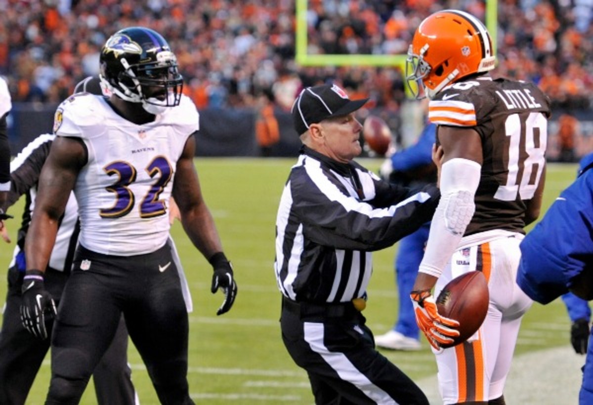 Browns receiver Greg Little (right) was flagged for taunting James Ihedigbo. (AP)
