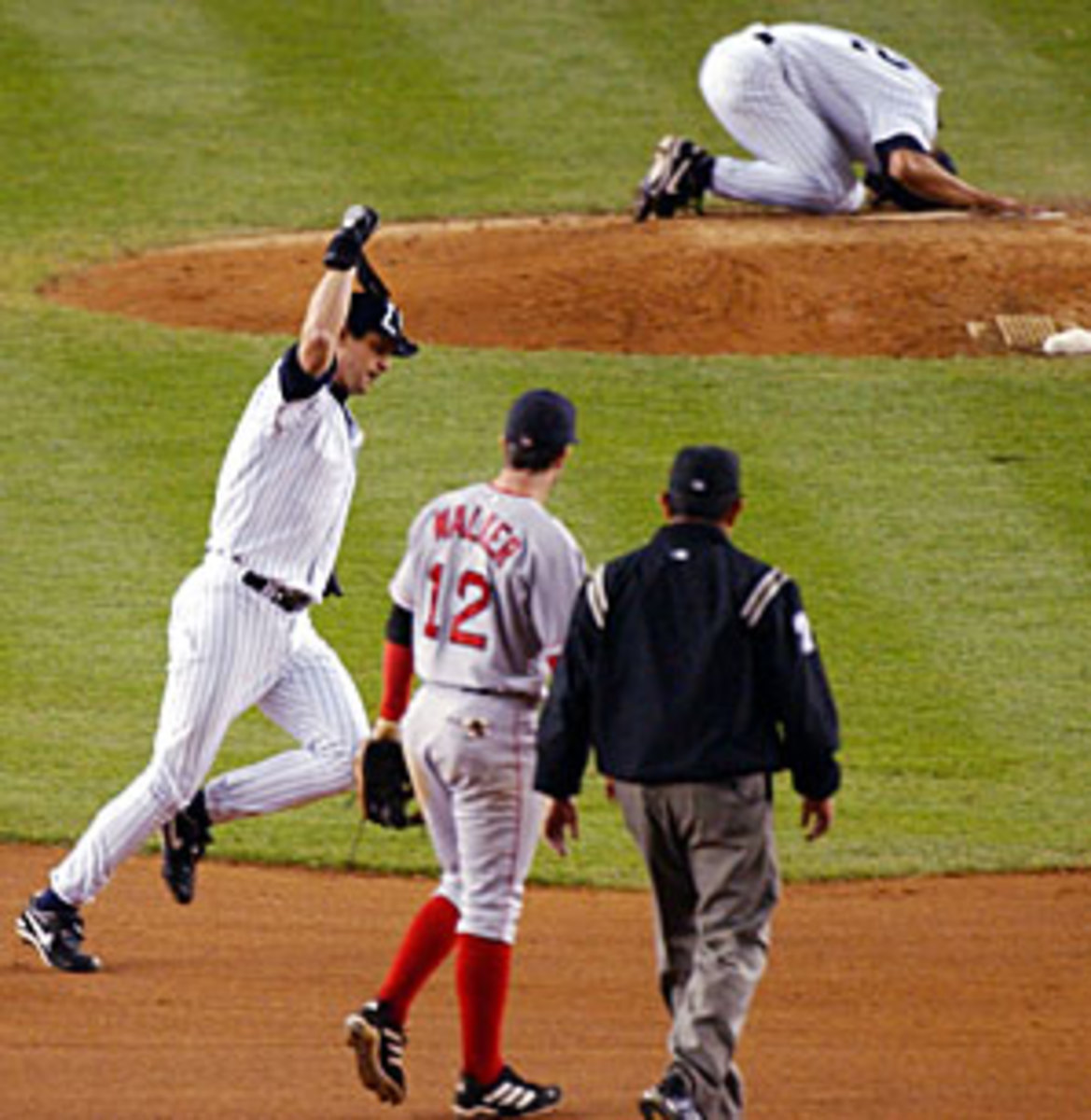 Rivera ran to the mound and collapsed in tears after Aaron Boone's home run beat the Red Sox in the 2003 ALCS. (Bill Kostroun/AP)