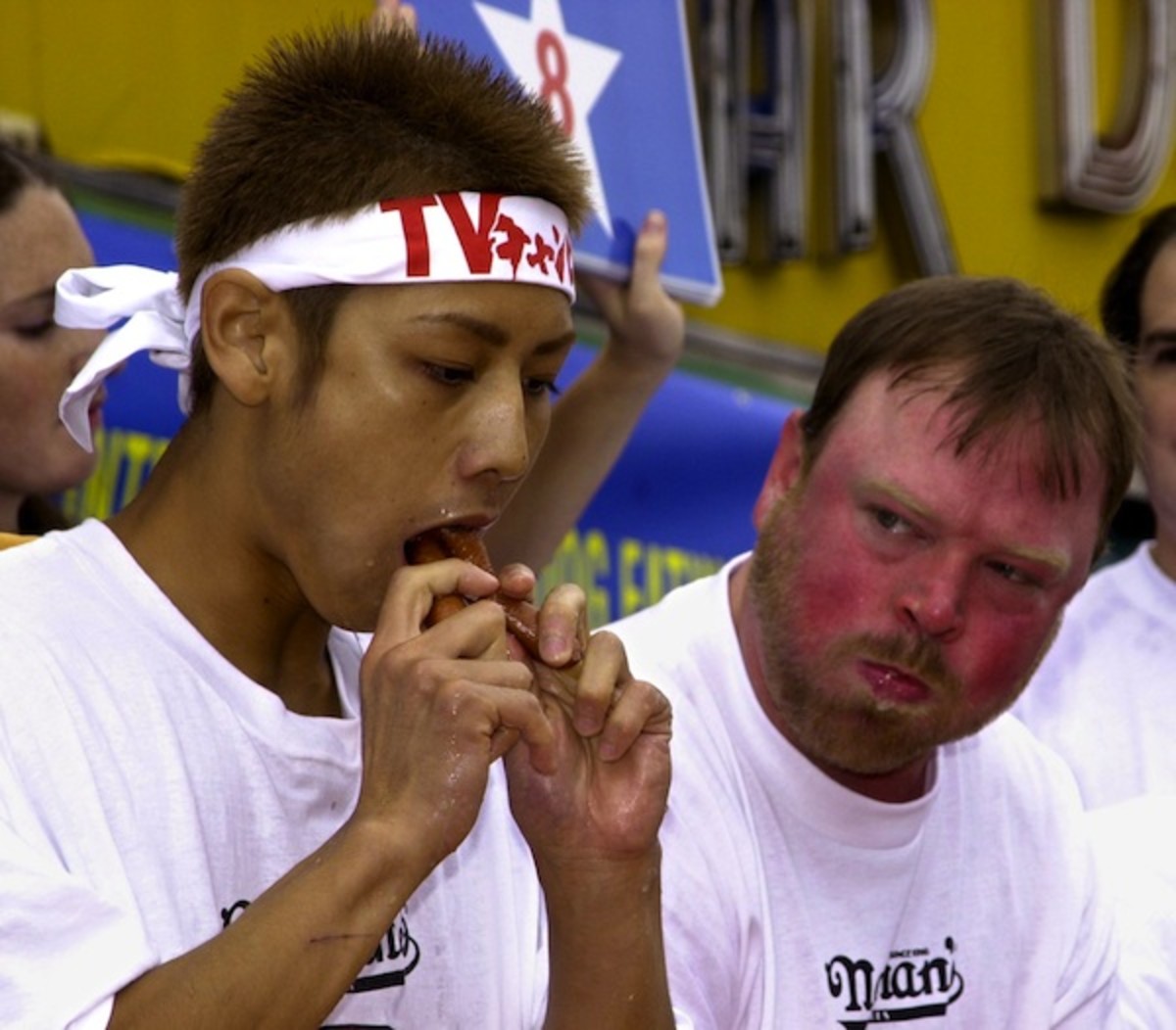 Japan's Takeru Kobayashi (L), a 131 lbs. (59 kgs)