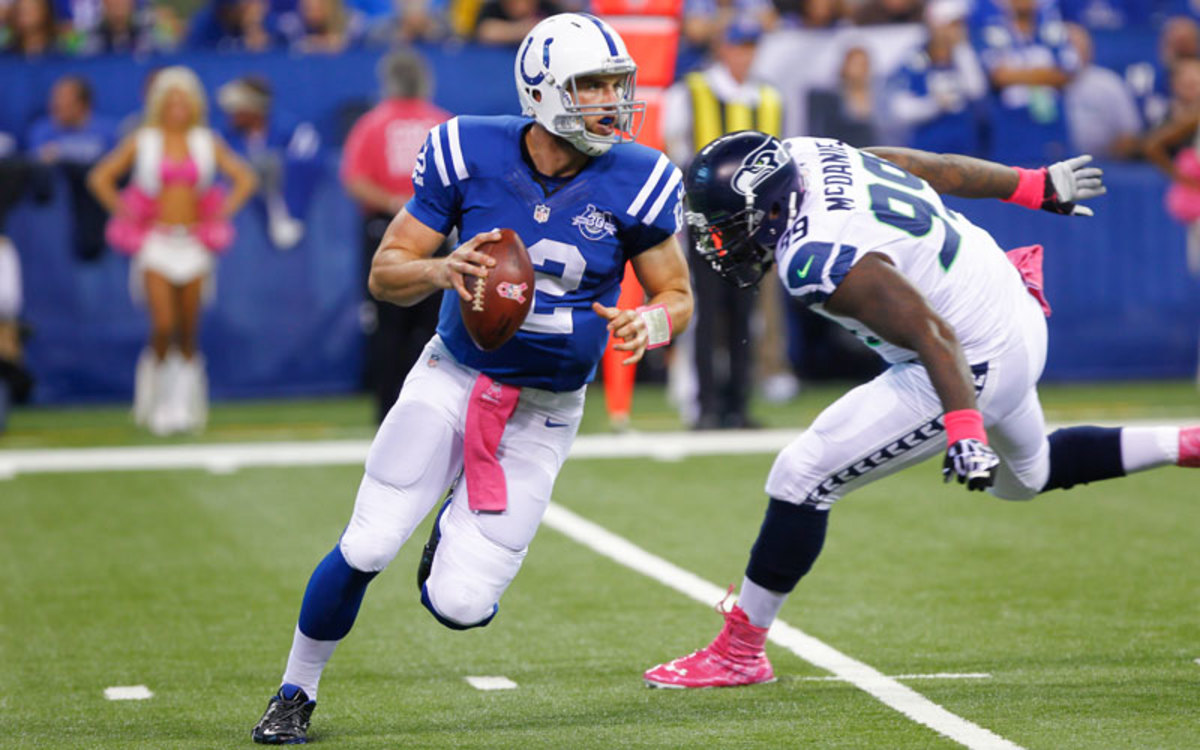 Because of his athleticism, Andrew Luck is able to keep plays alive in the face of rushing defenders and find room to use his arm strength to finish the job. (Michael Hickey/Getty Images)