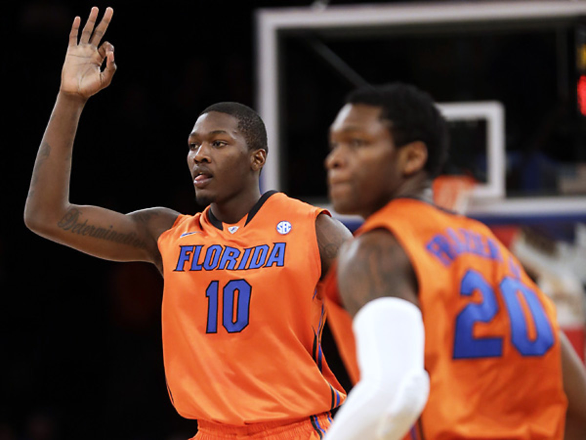 Florida's Dorian Finney-Smith (10) reacts after sinking a 3-pointer during the Gators' 77-75 win over Memphis. (Seth Wenig/AP)