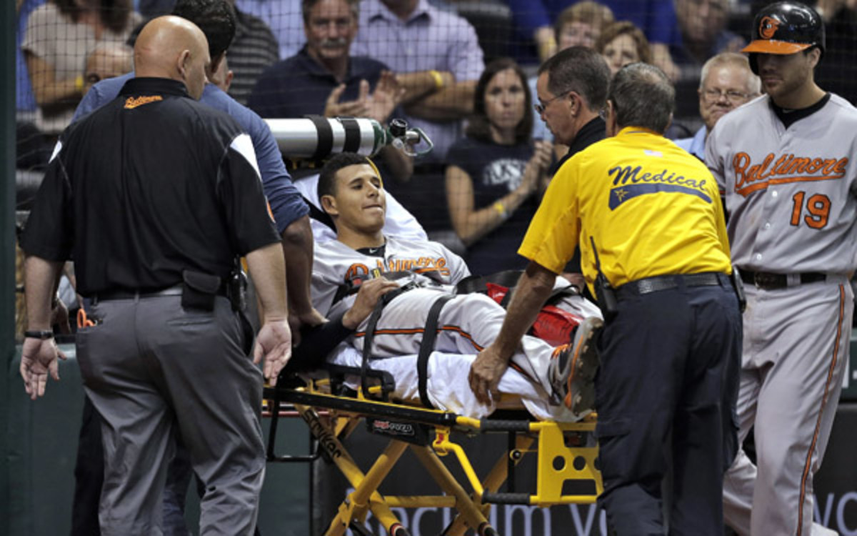 Orioles 3B Manny Machado was taken off on a stretcher after injuring his knee. (AP Photo/Chris O'Meara)