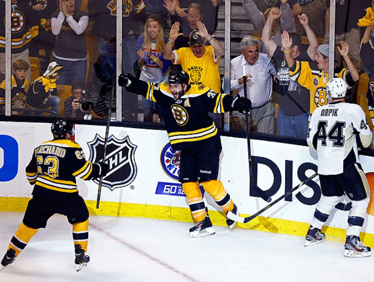 Patrice Bergeron (center) and Brad Marchand linked up for a winning goal built on years of playing together. (Jared Wickerham/Getty Images)