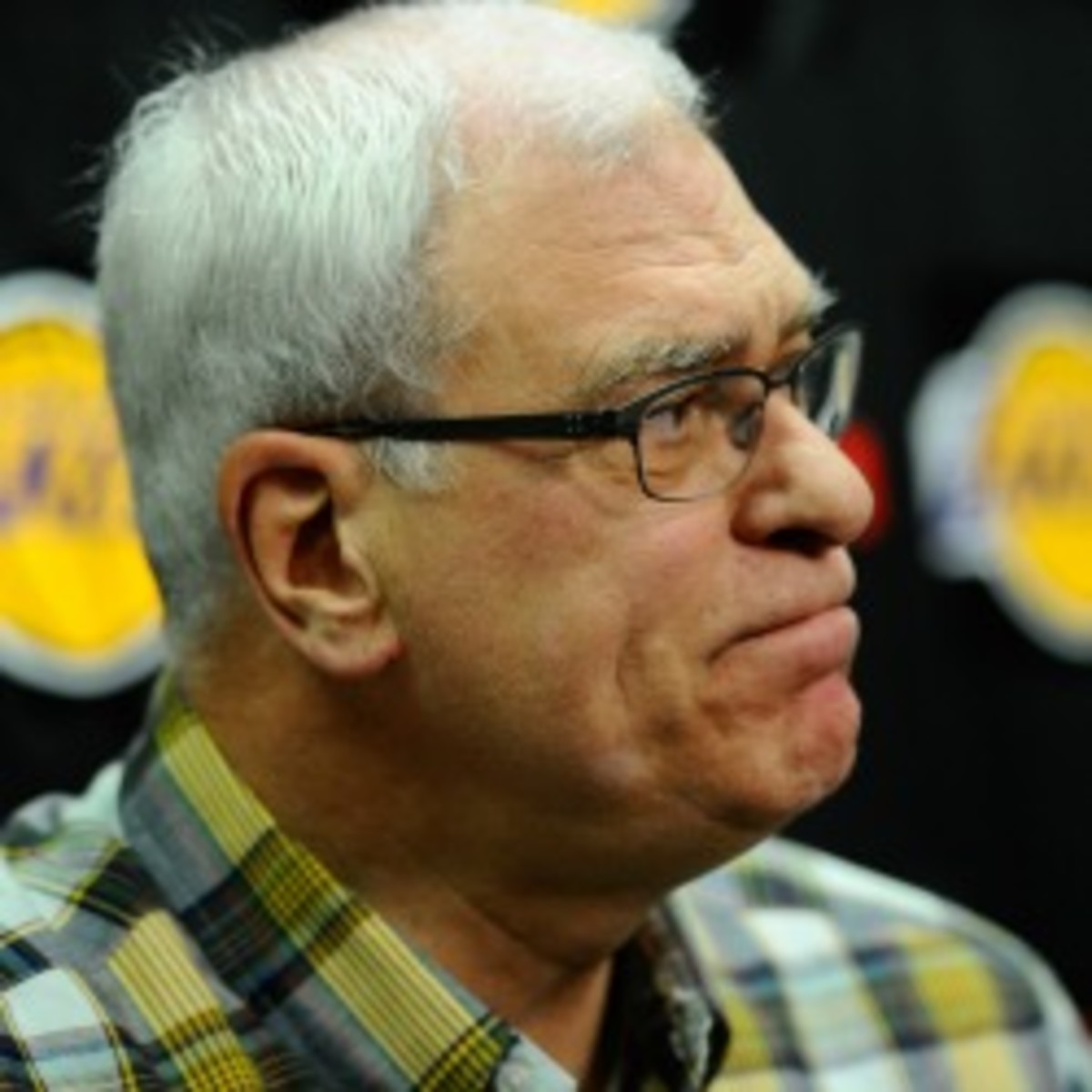 Phil Jackson, left, says he has discussed the possibility of taking a front office role with a number of teams. (Jim McIsaac/Getty Images)