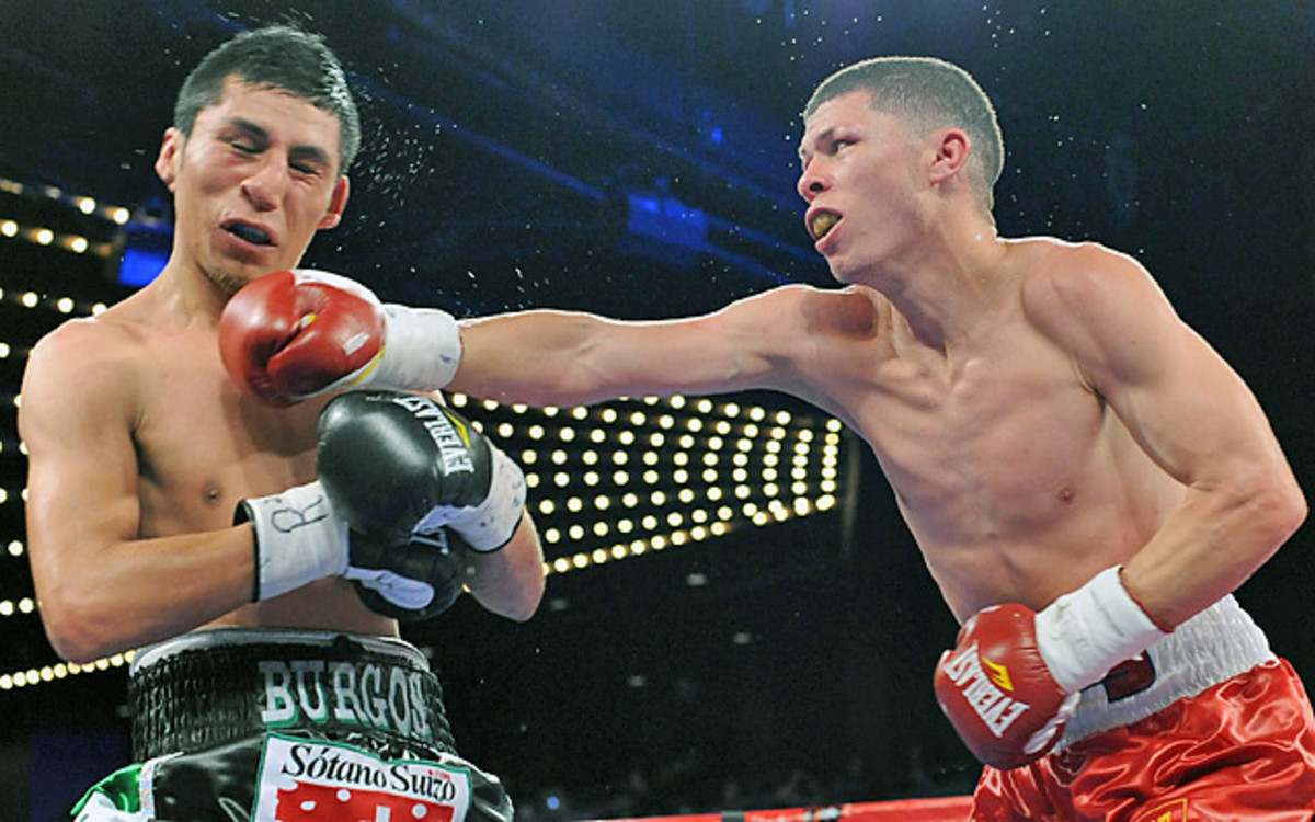Rocky Martinez (right) retained his WBO junior lightweight title after drawing Juan Carlos Burgos.  