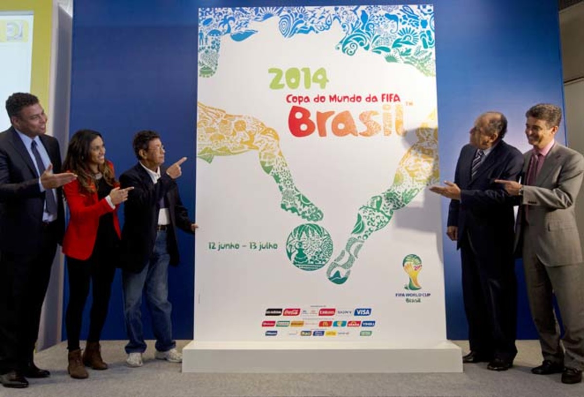 Ronaldo (left) and Marta (second form left) help present the 2014 World Cup poster.