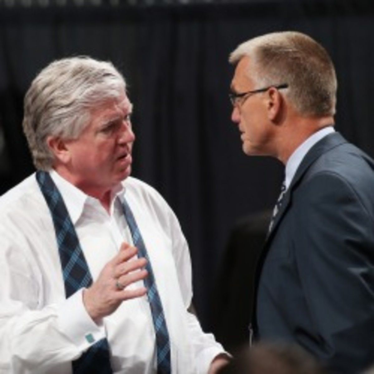 The Maple Leafs fired general manager Bruce Brian Burke (left). The team has not made the playoffs since 2004. (Bruce Bennett/Getty Images)