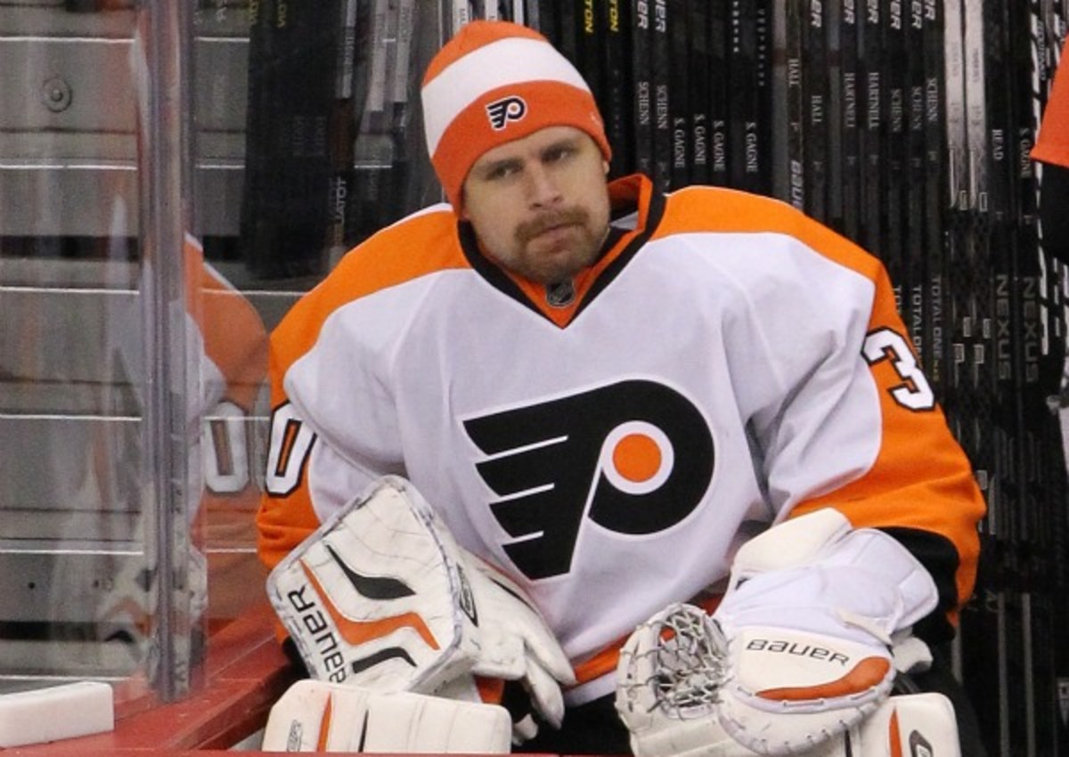 Ilya Bryzgalov struggled on and off the ice in Philadelphia. (Marianne Helm/Getty Images)