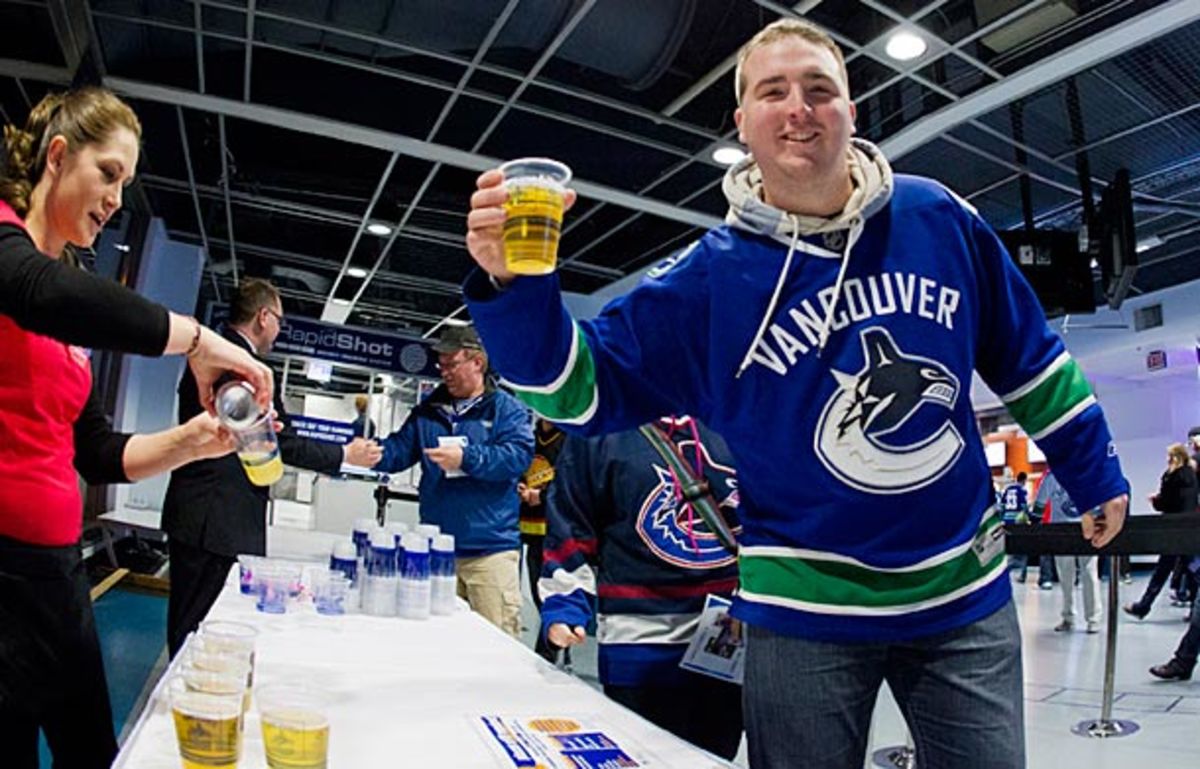 Canucks fan with a free beer