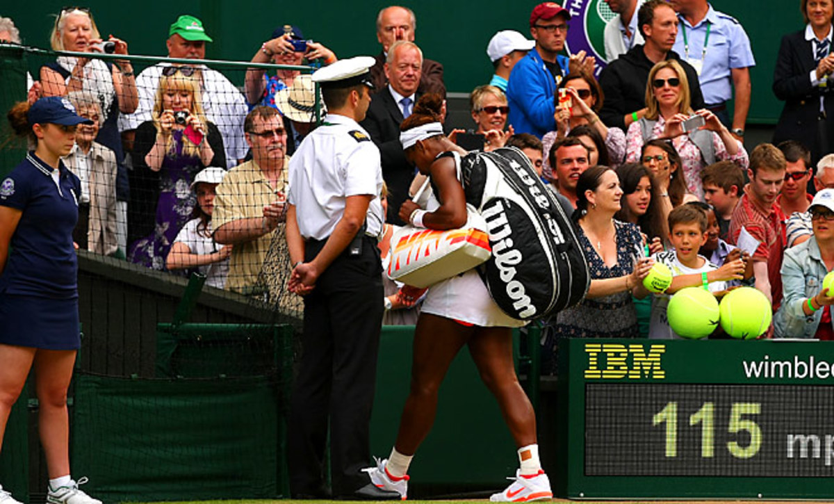 Serena Williams walks off the court after losing to Sabine Lisicki in the fourth round at Wimbledon.