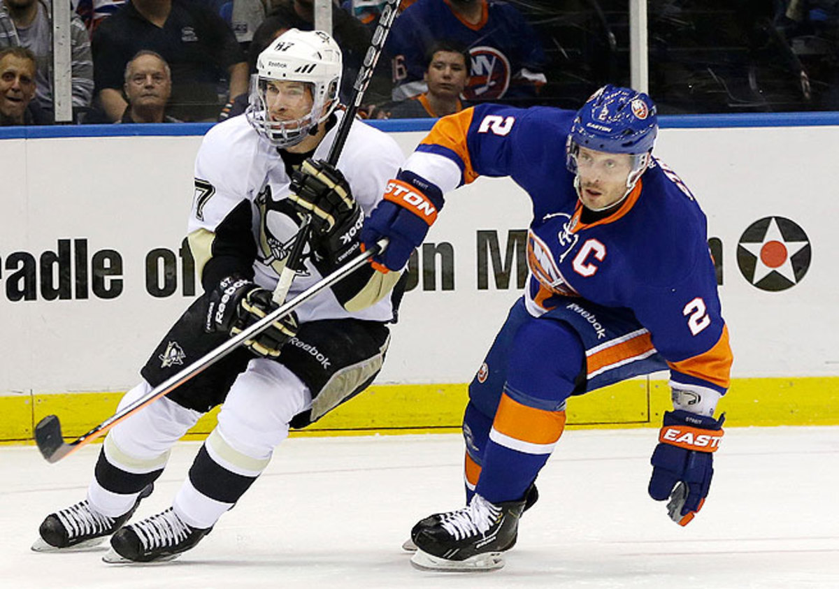 Mark Streit (right) captained the Islanders to a playoff appearance this year in which they lost to the Penguins.