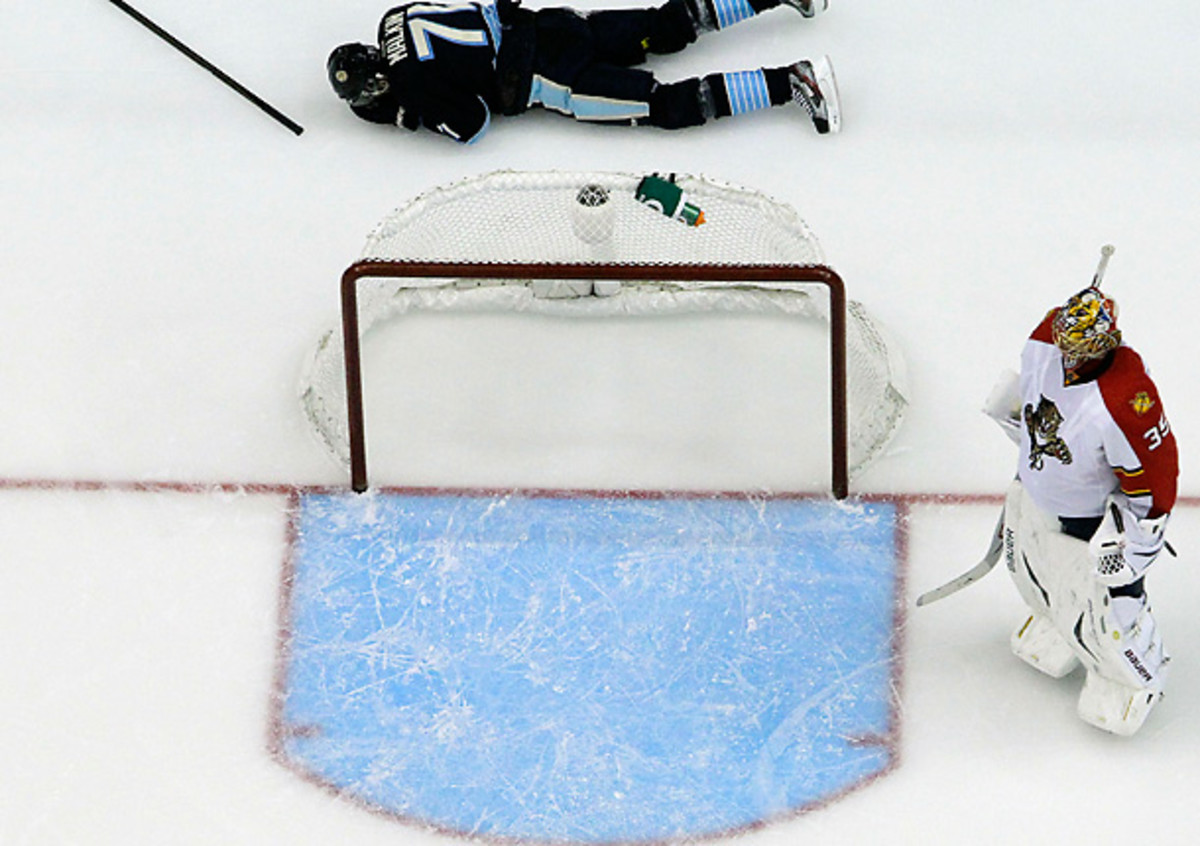 Evgeni Malkin is reeling after taking a big hit in last night's game against Florida. [Gene J. Puskar/AP]