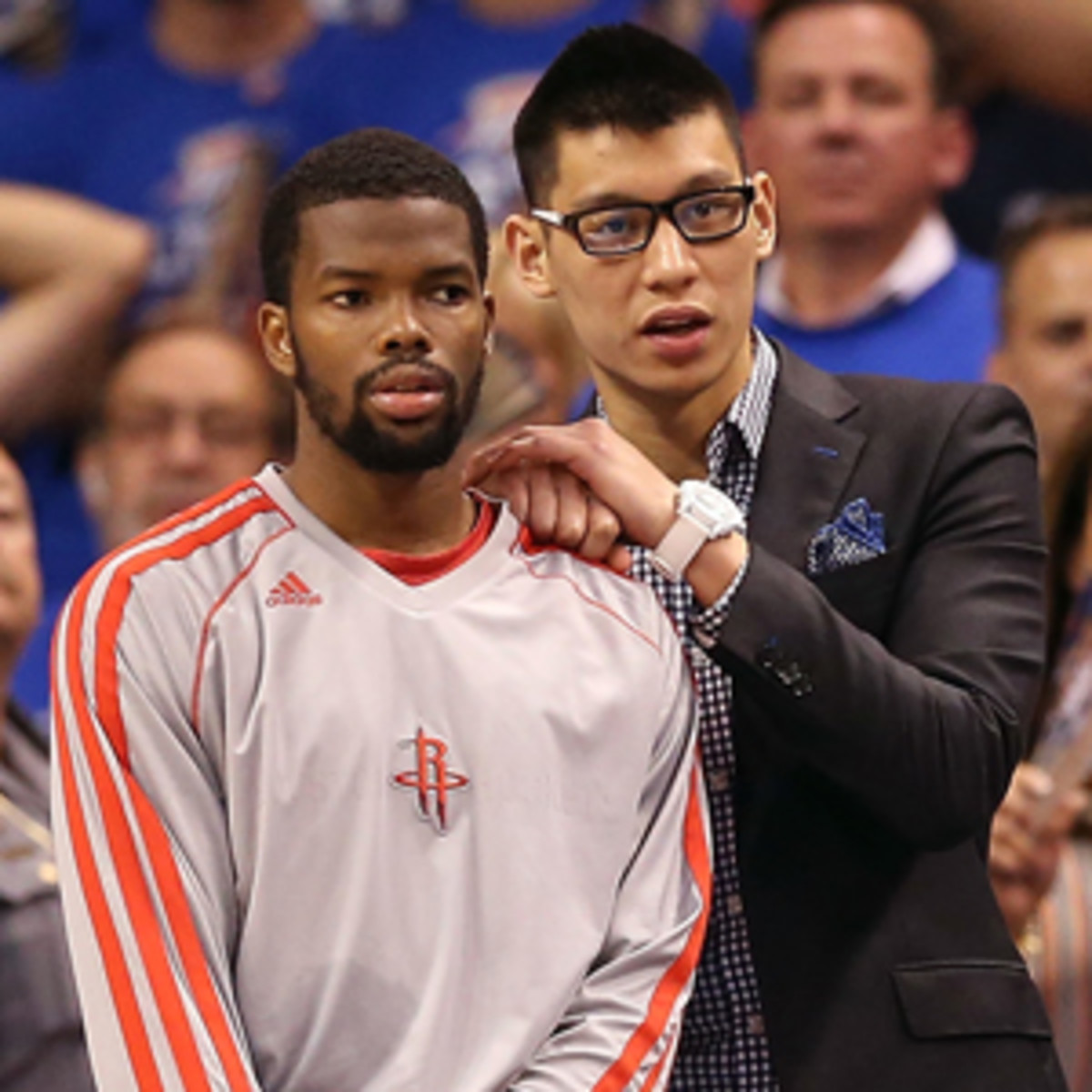Jeremy Lin cheered on Aaron Brooks and the Rockets while sidelined with an injury in Game 5. (Christian Petersen/Getty Images)
